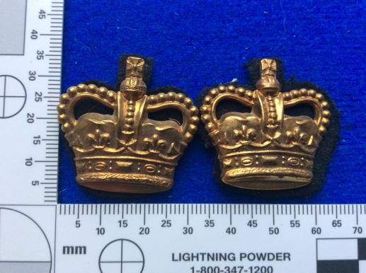 Post 1952 brass Queens Crowns with black backing 