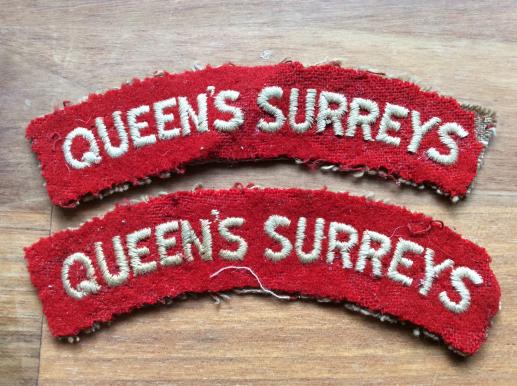 Pair of cloth QUEENS SURREYS Shoulder titles