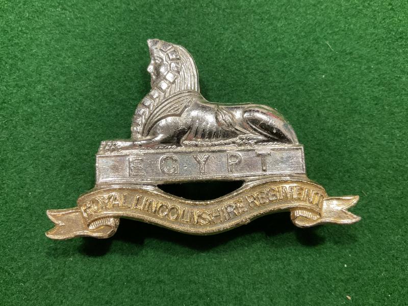 Anodised Royal Lincolnshire Regiment cap badge.