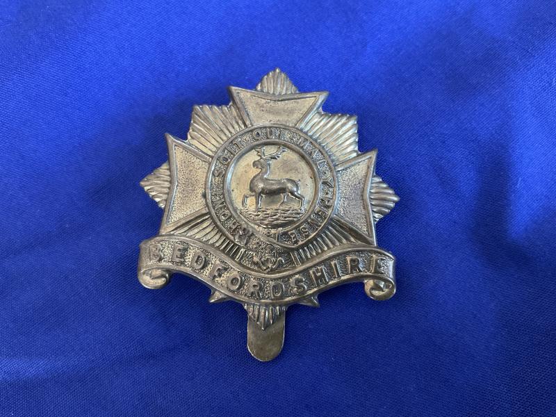 WW1 Bedfordshire Regiment economy brass cap badge.