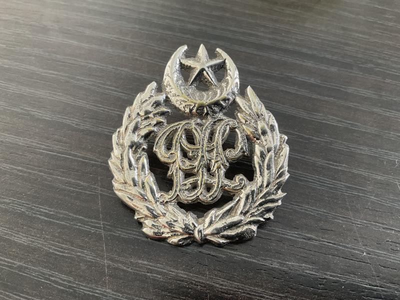 Pakistan Police cap badge.