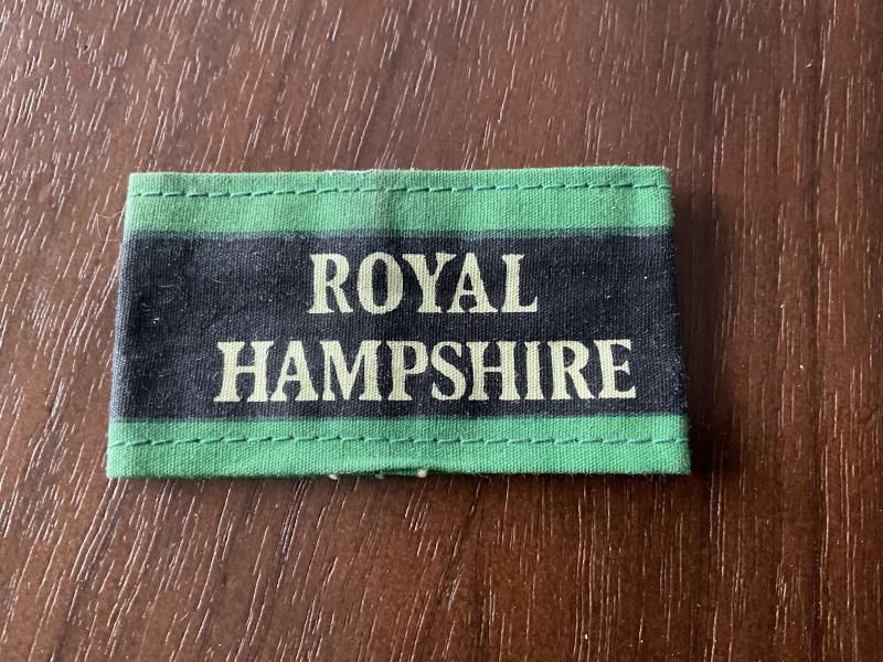 ROYAL HAMPSHIRE Regt Malaya era printed cloth slip on title.