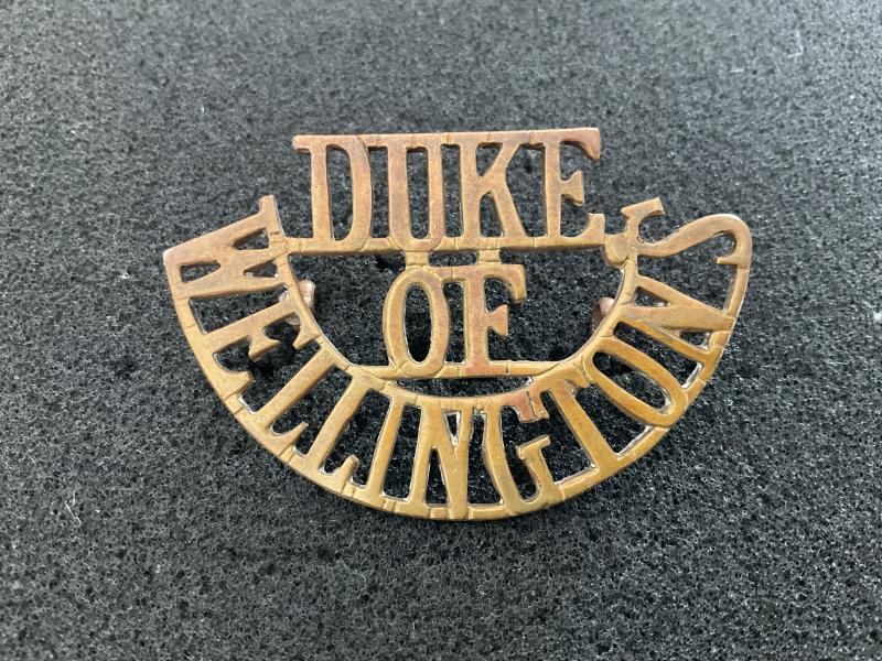 DUKE OF WELLINGTONS brass other ranks shoulder title.