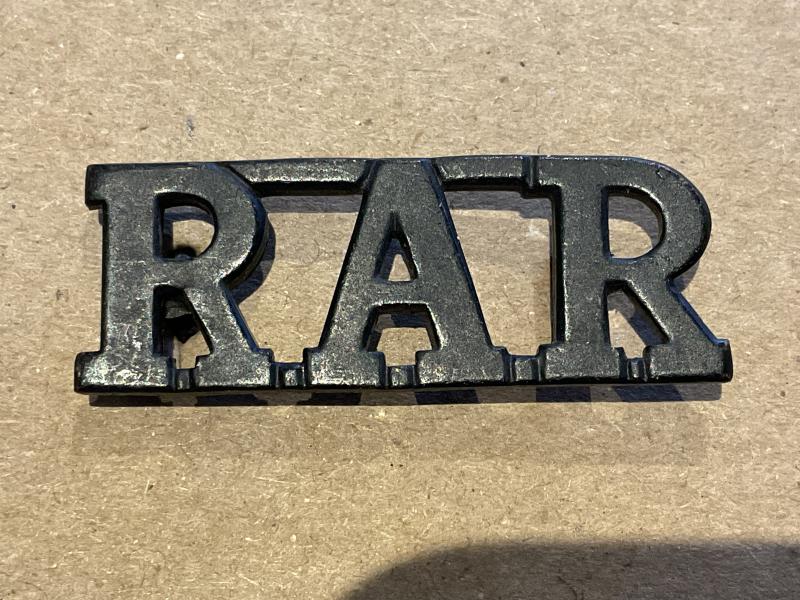 Rhodesian African Rifles (R.A.R) blackened brass title.